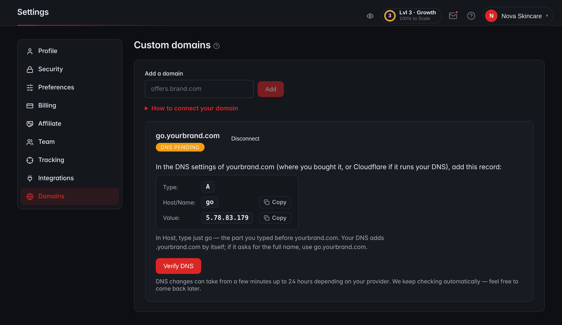 Settings → Domains in RevvyScales: a field to add a domain, a connected subdomain with DNS pending, the A record to add at the DNS provider with Copy buttons, and a Verify DNS button